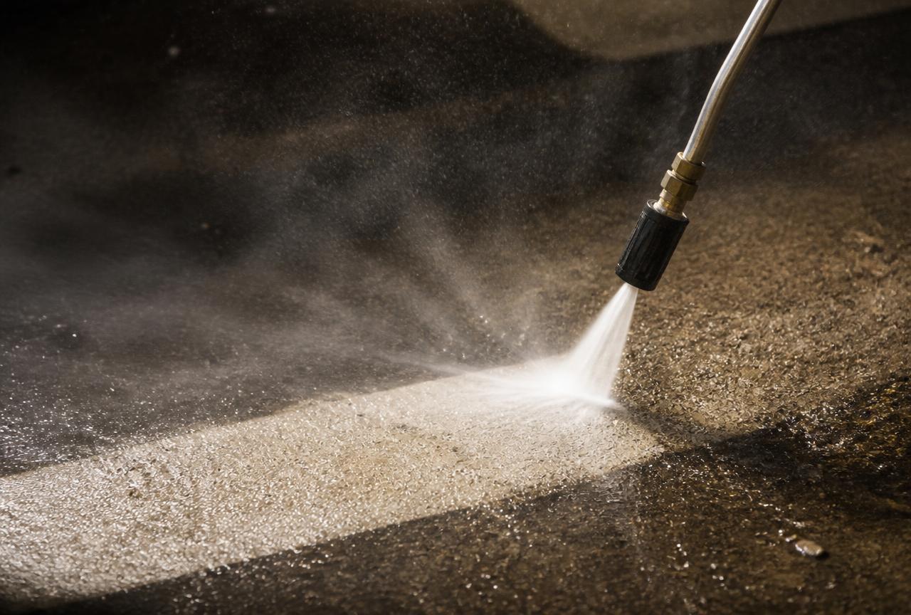 Pressure washing a concrete surface